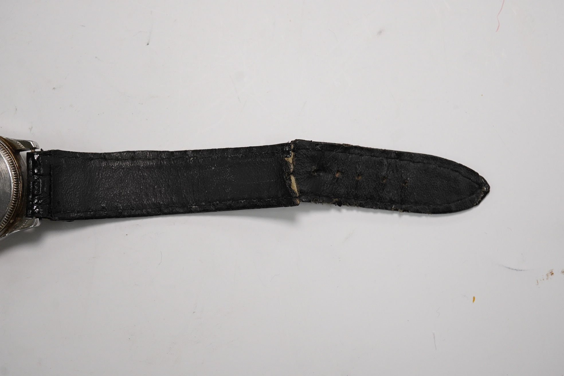 A stainless steel Tudor Oyster manual wind wrist watch, on an associated strap, case diameter 31mm. Condition - poor to fair